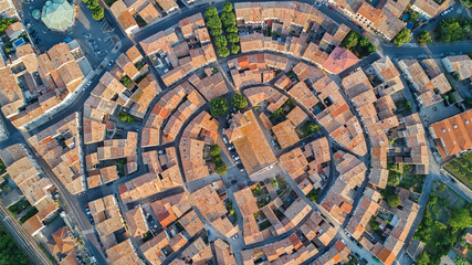 Aerial top view of Bram medieval village architecture and roofs from above, Southern France
