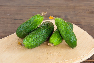 Cucumbers on a wooden background..
