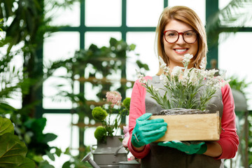 Happy woman with flower box