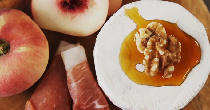 Cheese topped with walnut and sauce