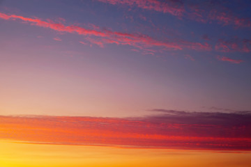 Fiery orange colorful sunset sky as background