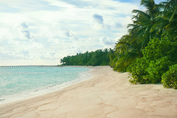 View of beautiful tropical beach at sea resort. Summer vacation concept