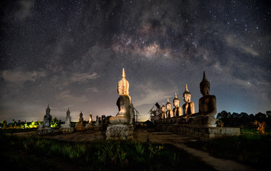 Background blur and sofe focus Milky Way and statues in the night sky dark vision blurred.In...
