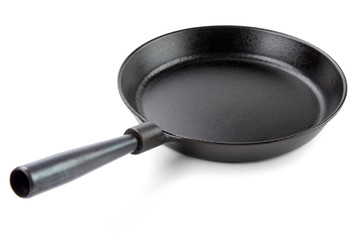 Cast iron skillet with carbon steel handle , white background
