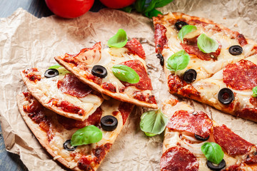 Slices of pizza pepperoni with olives