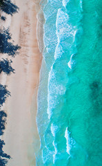 Sea aerial view,Top view,amazing nature background.The color of the water and beautifully bright.Azure beach with rocky mountains and clear water of Thailand ocean at sunny day.