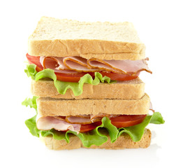 Sandwiches with lettuce,tomato,cold cuts on white