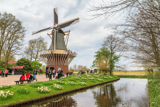 Tourists at the windmill in flower-park the Keukenhof (garden of europe, kitchen garden) in Lisse, the Netherlands
