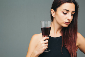 Beautiful girl with a glass of wine