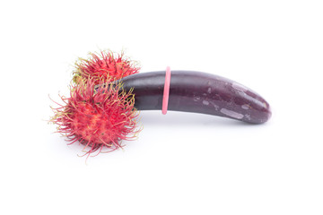 abstract condom with eggplants and rambutan isolated on white background