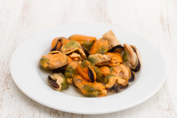 seafood in white plate on white wooden background