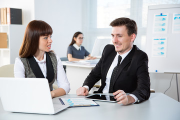 Young business people discussing a new project at a meeting