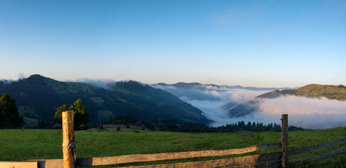 Fog and Clouds with mountain at sunrise in in Carpathians