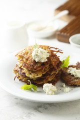 Potato latkes with cream cheese and herbs