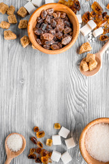 sugar lumps for sweet food cooking on kitchen gray table top view mock up