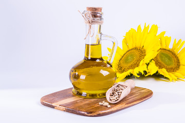 Sunflower seed oil in glass bottle on white background