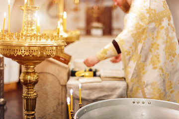 Priest wearing gold robe on ceremony in christian cathedral church, holy sacramental event.