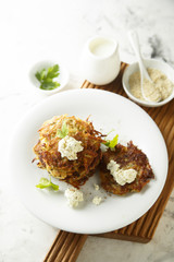 Potato latkes with cream cheese and herbs