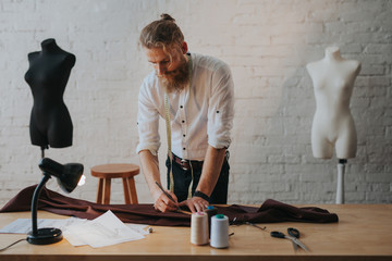 Man creating new clothes in parlour