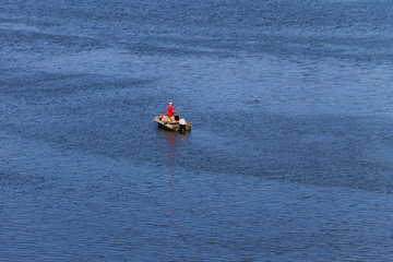 Boat with fishermen at the river Dnieper, Ukraine