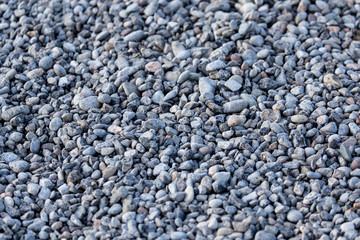 Crushed stone on the road as a background