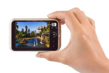 Hand with camera and Monte Tropical Garden and Palace - Madeira Portugal (my photo)