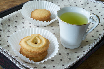 Obraz na płótnie Canvas Danish butter cookies with a cup of tae