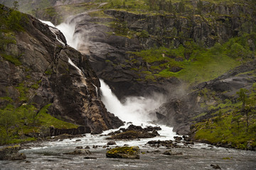 Waterfall in mountains of Norway in rainy weather - 165549205