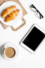 Business lunch with tablet on white table top view