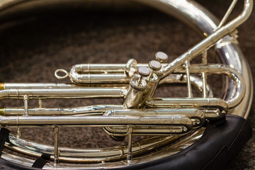 sousaphone resting on the floor waiting for its turn to perform