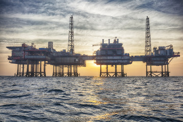 HDR of Offshore oil platform in The Middle of The Sea at Sunset Time 