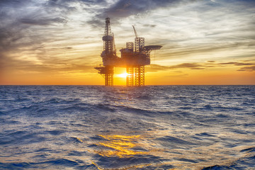 HDR of Offshore Jack Up Rig in The Middle of The Sea at Sunset Time 