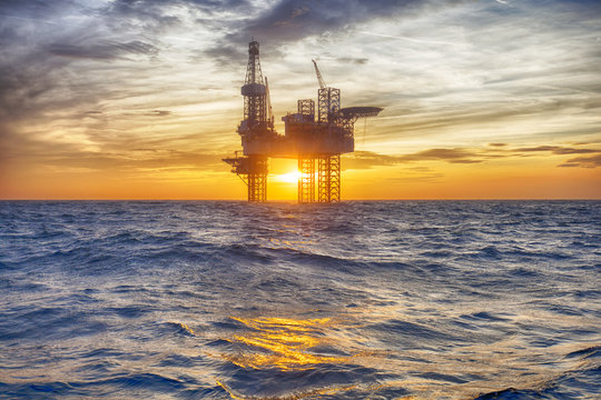 HDR of Offshore Jack Up Rig in The Middle of The Sea at Sunset Time 