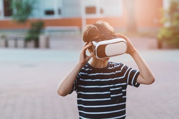 Boy watching simulation in virtual reality googles