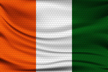 Obraz premium National flag of Ivory coast on wavy fabric with a volumetric pattern of hexagons. Vector illustration.