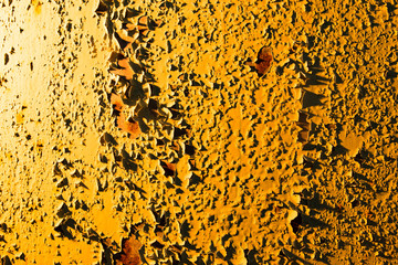 Old rusty metal in golden light as background