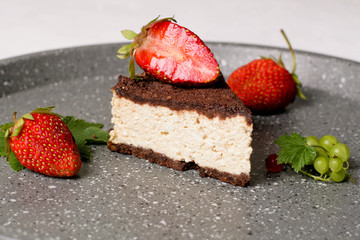 Delightful cocoa cake with cottage cheese filling with strawberries and mint