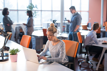businesswoman using a laptop in startup office
