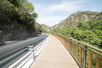 a curving road into nature near Benahavis, Spain