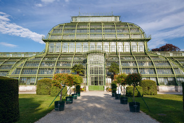 Fototapeta na wymiar The Palmenhaus Schoenbrunn - a large greenhouse, opened in 1882 in the park Schoenbrunn in Vienna, Austria