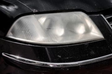 headlight car unpolished misted over from within. © Александр Беспалый