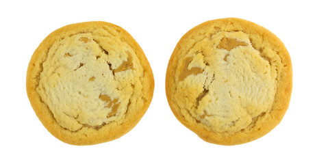 Top view of two chunky peanut butter cookies isolated on a white background.