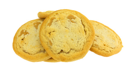 Several chunky peanut butter cookies isolated on a white background.