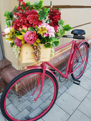 Fototapeta na wymiar Pink bicycle with flower box