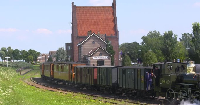 MEDEMBLIK, THE NETHERLANDS - JULY 2017: steam locomotive 7742 Bello, the only preserved light steam engine in the Netherlands, departs from Medemblik Station on the Hoorn�Medemblik heritage railway.