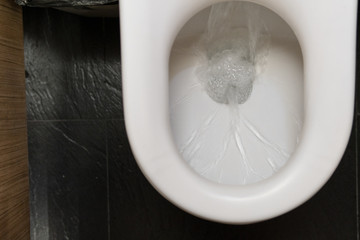 Water drained into the toilet bowl After the technician came to repair a toilet. When its did not...