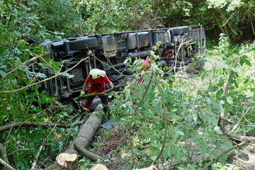 Real event, Truck accident, The truck crashed on the road and overturned. Carriage of new cars.