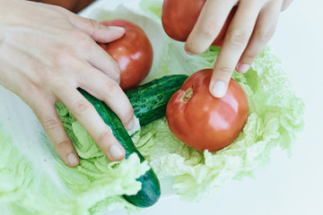 Man with a beard on a light background, vegetables, diet, vegetarianism, vegetarian