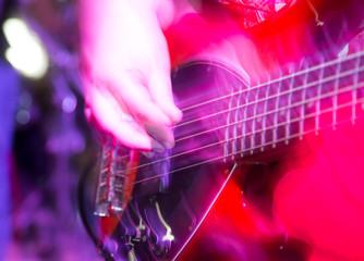 Fototapeta na wymiar Musician playing guitar in a rock band