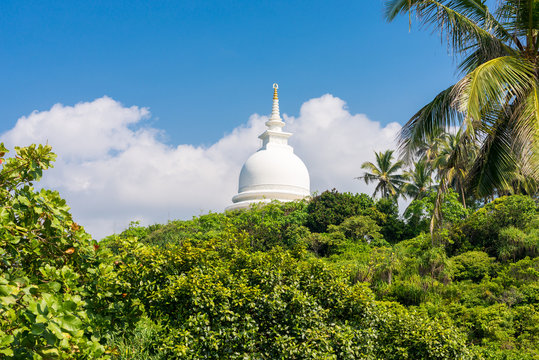 The hemispherical dome named Stupa, from the Japanese Peace Pagoda on top of the Rumassala hill in the Jungle. The Buddhist monastery exists since 2004 and is situated opposite side of the city Gall